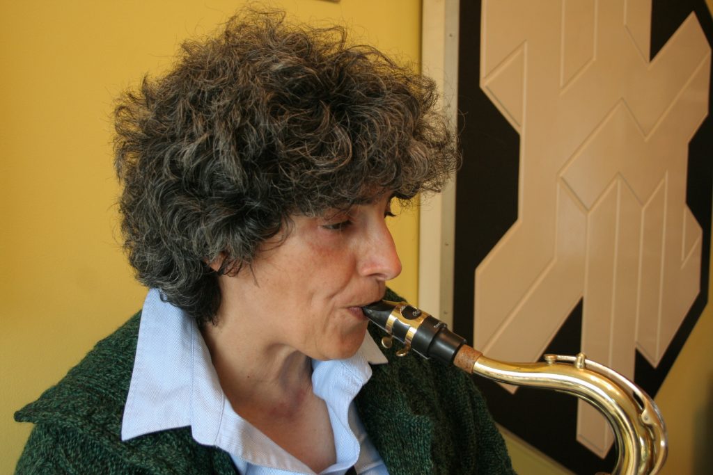 The teacher playing the saxophone